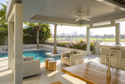 Luxurious villa patio with swimming pool and view on a golf course